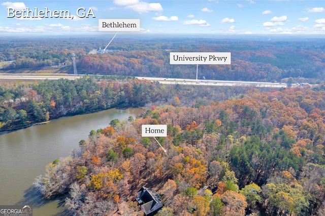 birds eye view of property featuring a water view