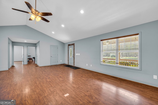 unfurnished living room with wood-type flooring, ceiling fan, and lofted ceiling