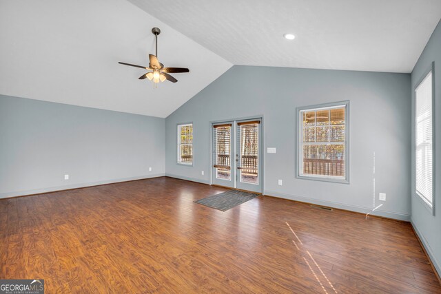 empty room featuring lofted ceiling, french doors, ceiling fan, and dark hardwood / wood-style floors