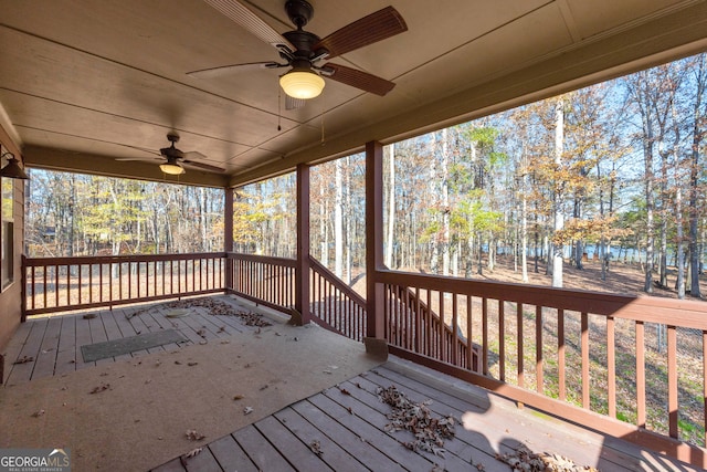 wooden deck featuring ceiling fan