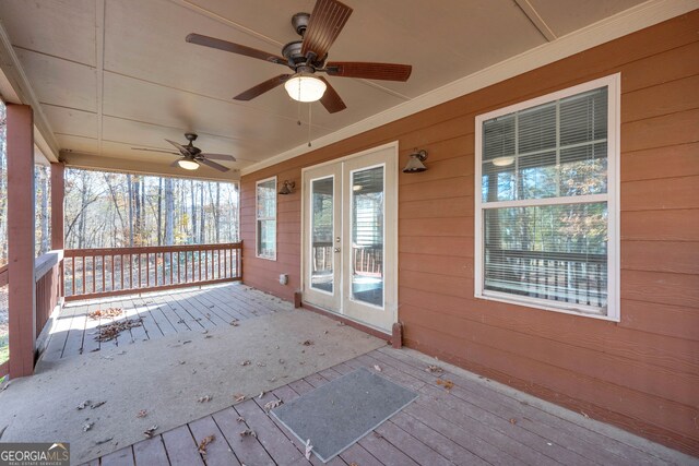 wooden terrace featuring ceiling fan and french doors