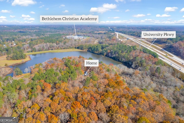 drone / aerial view with a water view