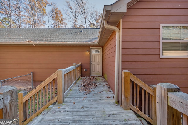 view of exterior entry featuring a deck