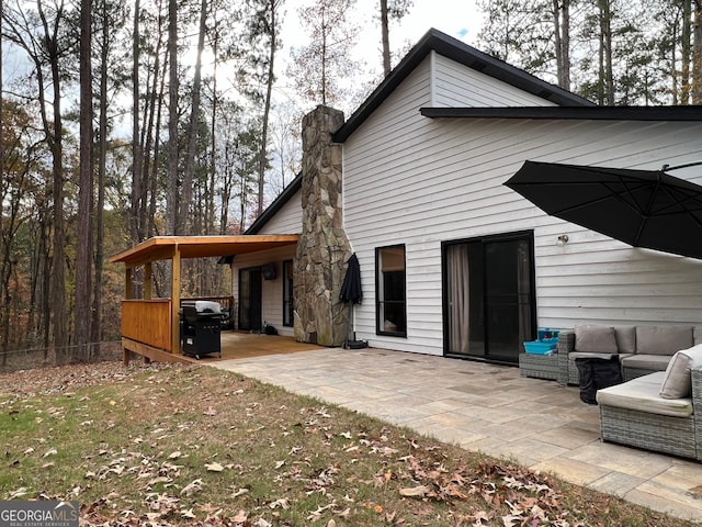 back of property featuring a patio area