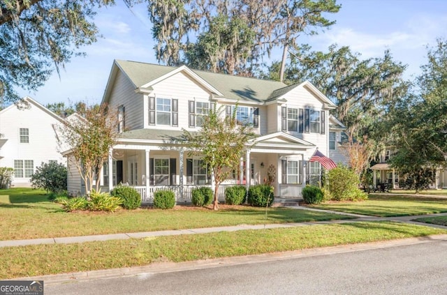 view of front of house with a porch and a front lawn