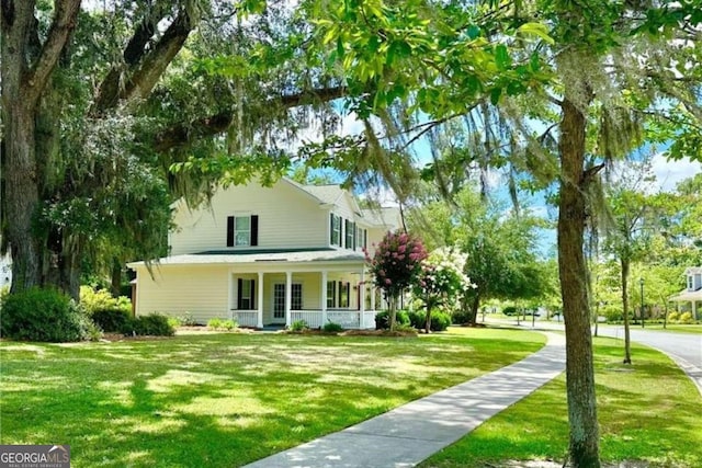 view of front facade with a front lawn and a porch