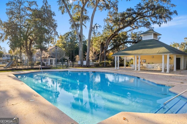 view of pool featuring a patio