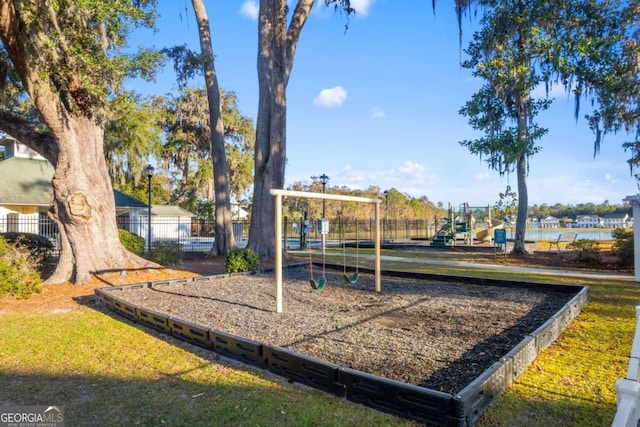 view of jungle gym with a water view