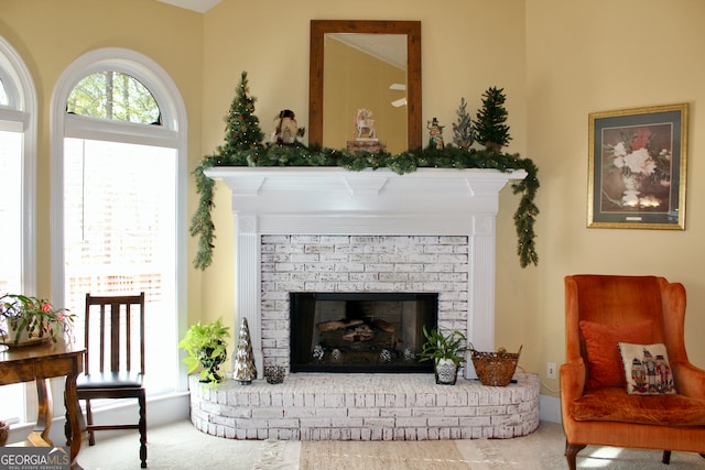 sitting room featuring carpet flooring and a fireplace