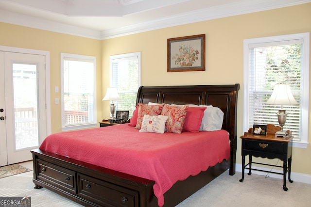 bedroom with access to exterior, light colored carpet, multiple windows, and crown molding