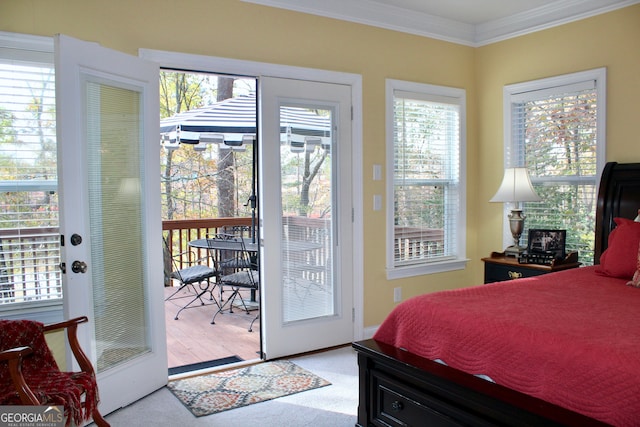 carpeted bedroom featuring crown molding, access to outside, and french doors