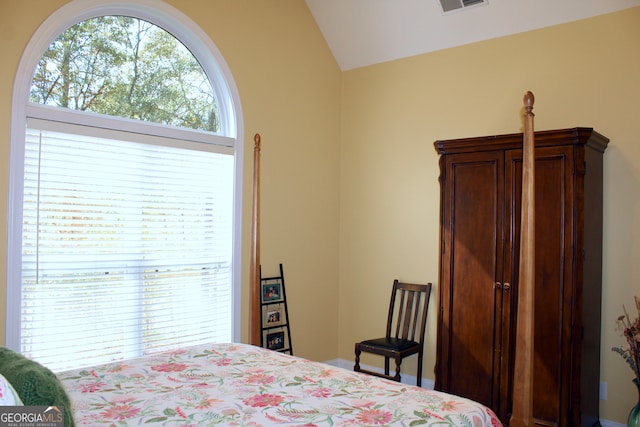 bedroom featuring lofted ceiling