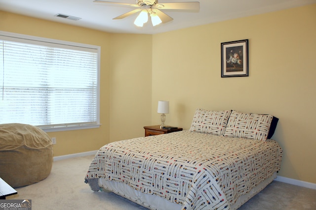 carpeted bedroom with ceiling fan