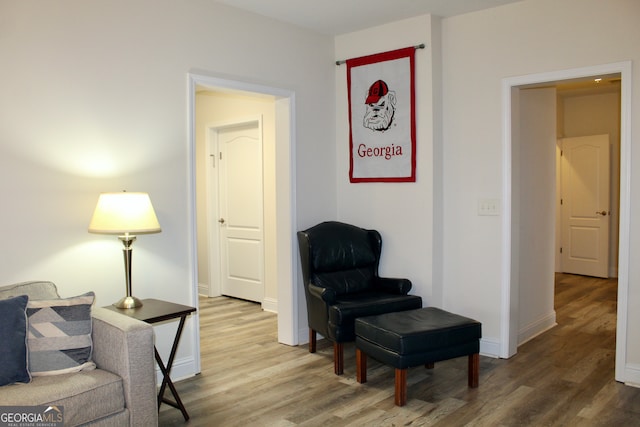 sitting room featuring hardwood / wood-style floors