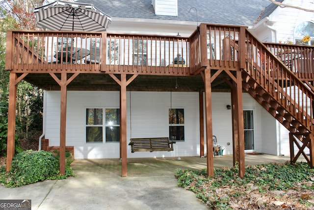 back of property with a patio and a deck