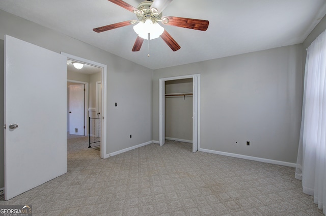 unfurnished bedroom featuring ceiling fan, light carpet, and a closet