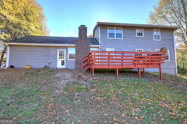 rear view of house with a wooden deck