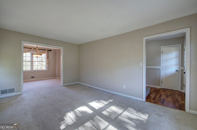 empty room featuring light colored carpet