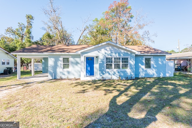 single story home featuring a carport and a front lawn