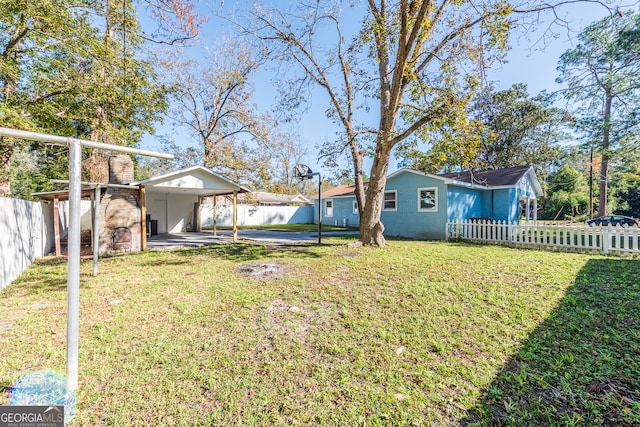 view of yard with a carport