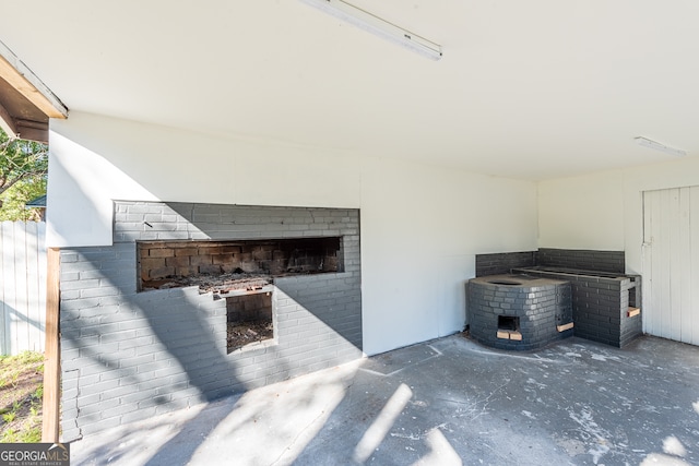 view of patio featuring a fireplace