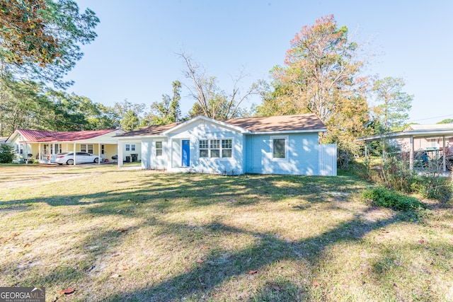 ranch-style home featuring a front yard