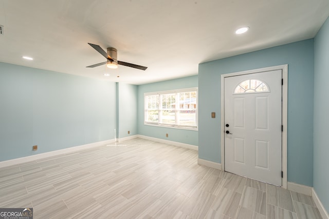 foyer entrance featuring ceiling fan and light hardwood / wood-style floors