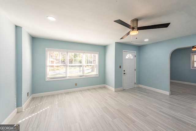 foyer featuring ceiling fan and light hardwood / wood-style flooring