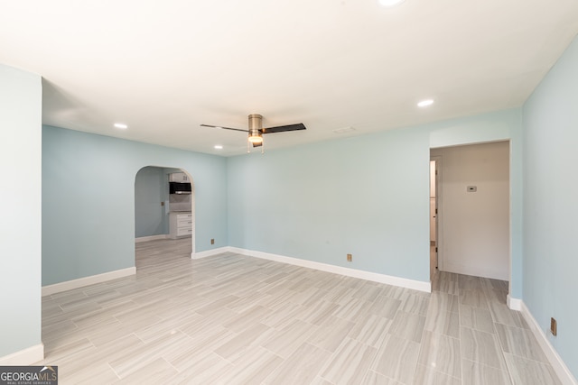 unfurnished room featuring ceiling fan and light hardwood / wood-style flooring