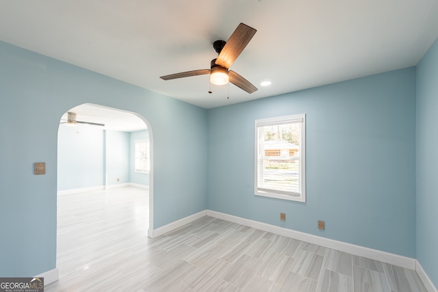 empty room with light hardwood / wood-style floors and ceiling fan