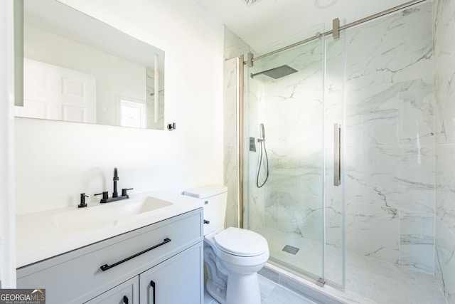 bathroom featuring walk in shower, vanity, and toilet