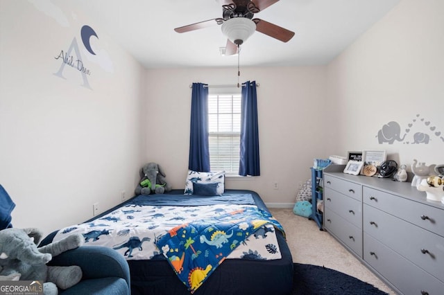 bedroom featuring light carpet and ceiling fan