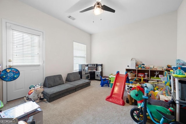 playroom featuring carpet and ceiling fan