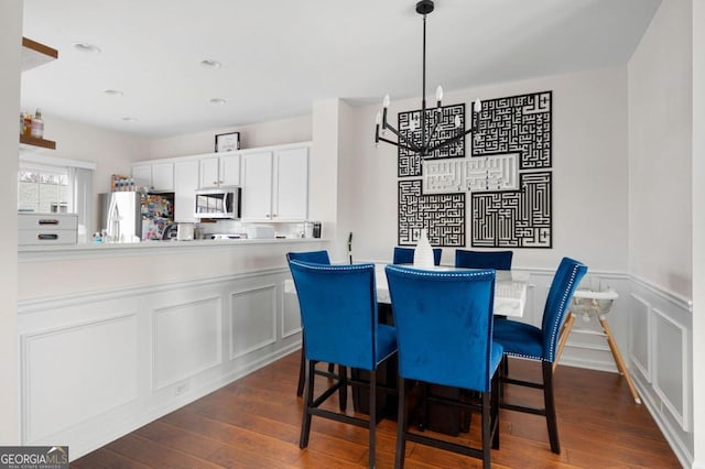 dining area featuring dark hardwood / wood-style flooring