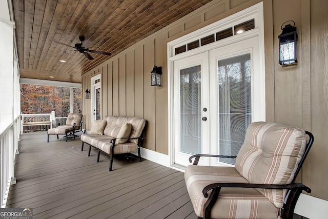 wooden terrace featuring ceiling fan and a porch