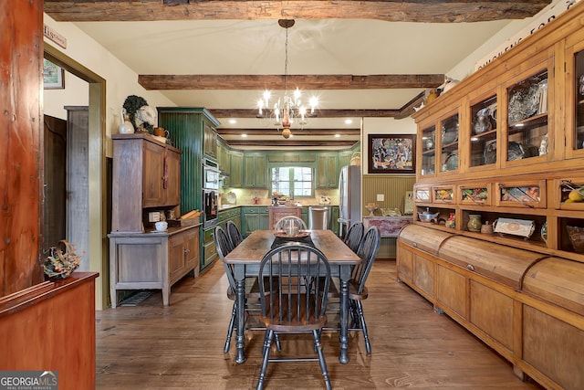 dining area featuring beamed ceiling, a notable chandelier, and dark hardwood / wood-style floors