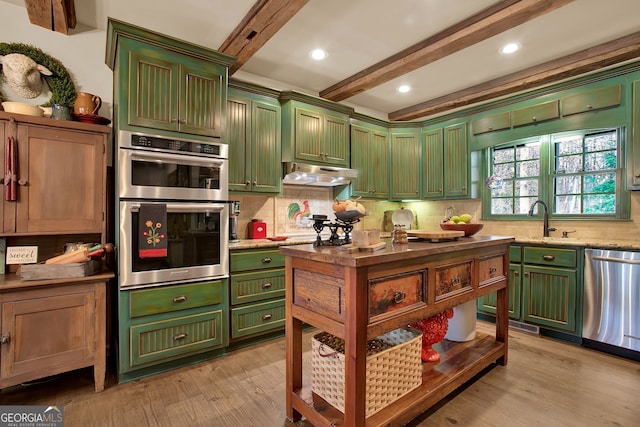 kitchen with sink, decorative backsplash, light hardwood / wood-style floors, beam ceiling, and stainless steel appliances