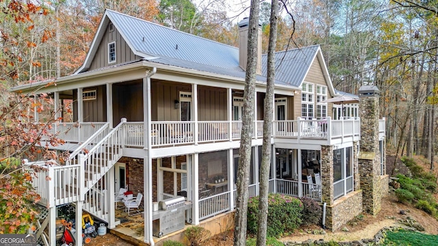 rear view of house with a sunroom