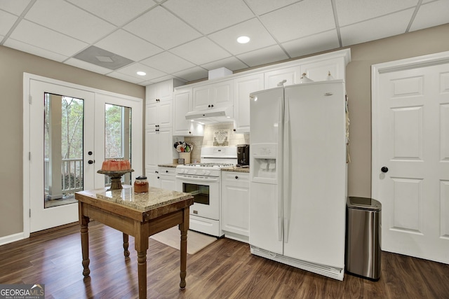 kitchen with dark hardwood / wood-style floors, white cabinetry, and white appliances