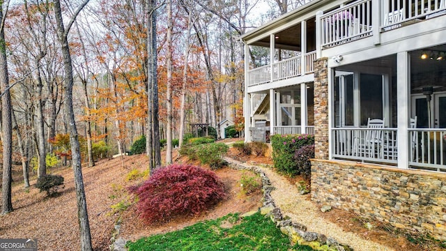 view of yard featuring a sunroom