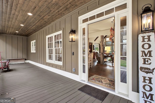 wooden terrace with a porch