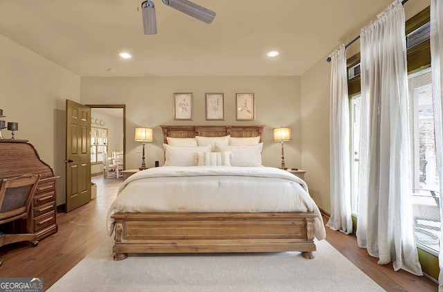 bedroom with ceiling fan and light wood-type flooring