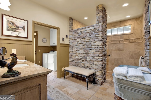 bathroom featuring vanity and separate washer and dryer