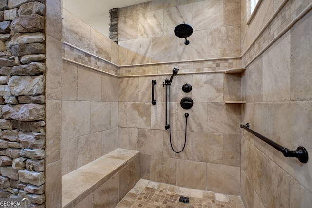 bathroom featuring a tile shower