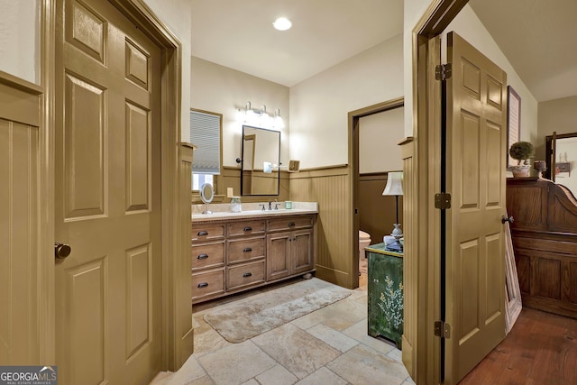 bathroom with hardwood / wood-style flooring and vanity