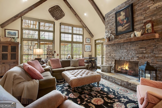 living room featuring a stone fireplace, beamed ceiling, and high vaulted ceiling