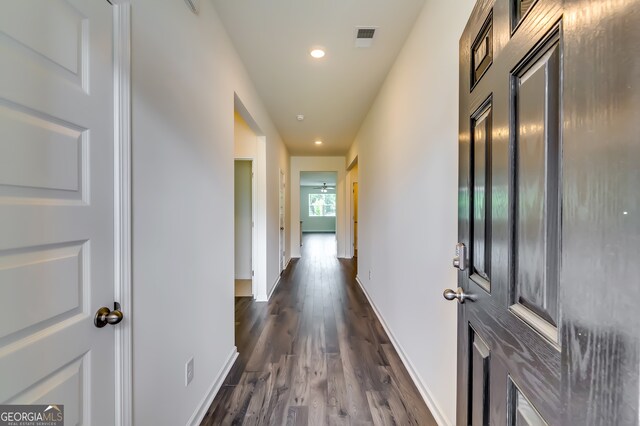 hall with dark hardwood / wood-style floors