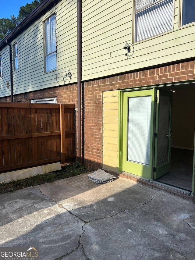 view of side of property featuring a patio area