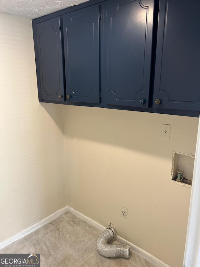 washroom with cabinets, electric dryer hookup, hookup for a washing machine, and electric panel