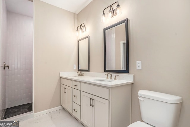 bathroom with vanity, toilet, and walk in shower